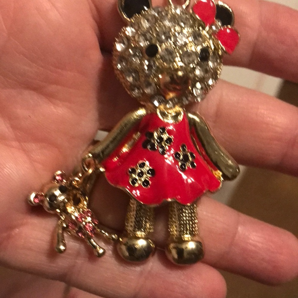 Red teddy bear with a baby teddy bear necklace